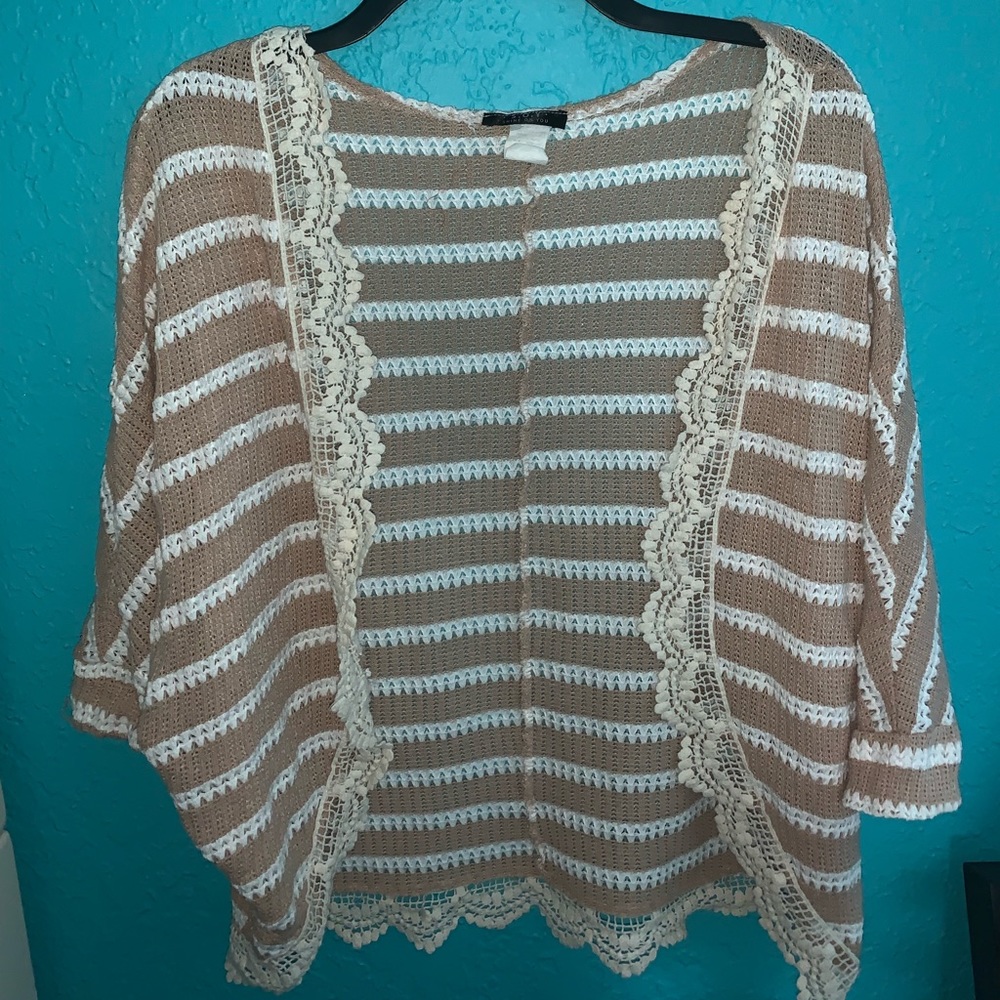 Tan and white cardigan.